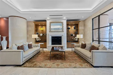 a living room with furniture fireplace and flat screen tv