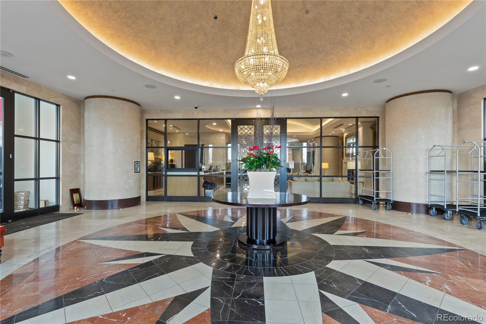 7600 Land Mark Way, Unit 1411 Greenwood Village, CO 80111 - Photo 50 of 50 a living room with dining table and a chandelier