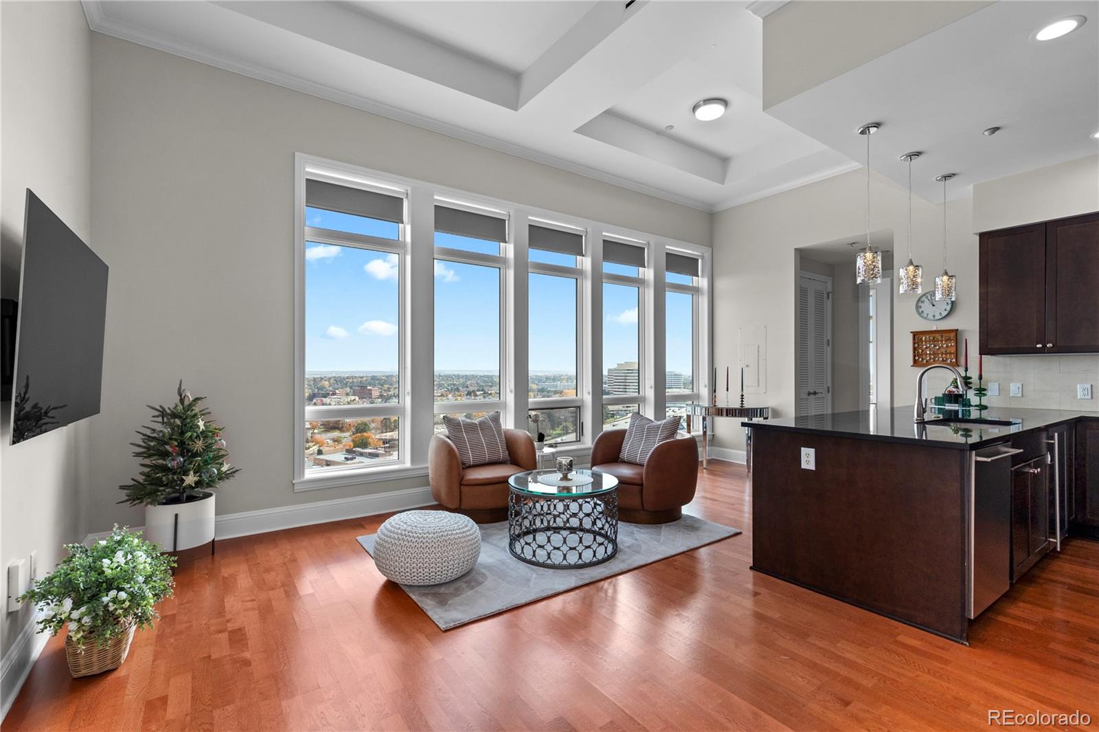 7600 Land Mark Way, Unit 1411 Greenwood Village, CO 80111 - Photo 5 of 50 a living room with furniture and a flat screen tv