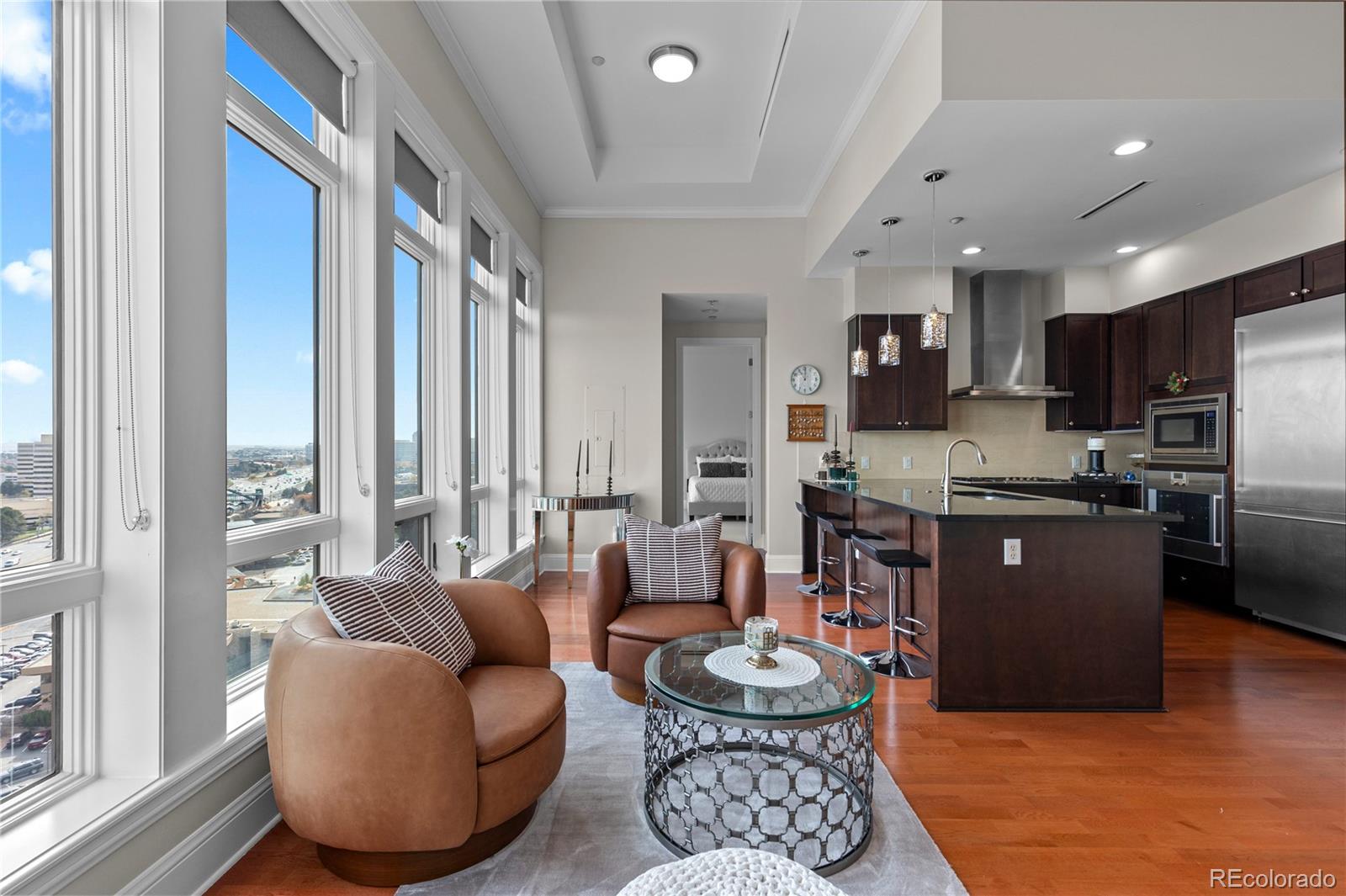 7600 Land Mark Way, Unit 1411 Greenwood Village, CO 80111 - Photo 7 of 50 a living room with furniture and a large window
