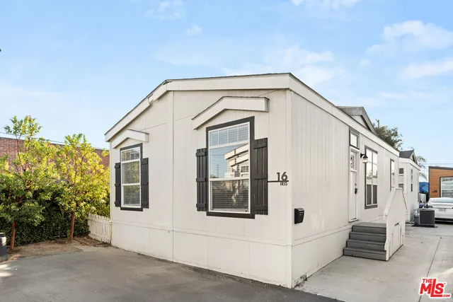 a view of white house with a large windows