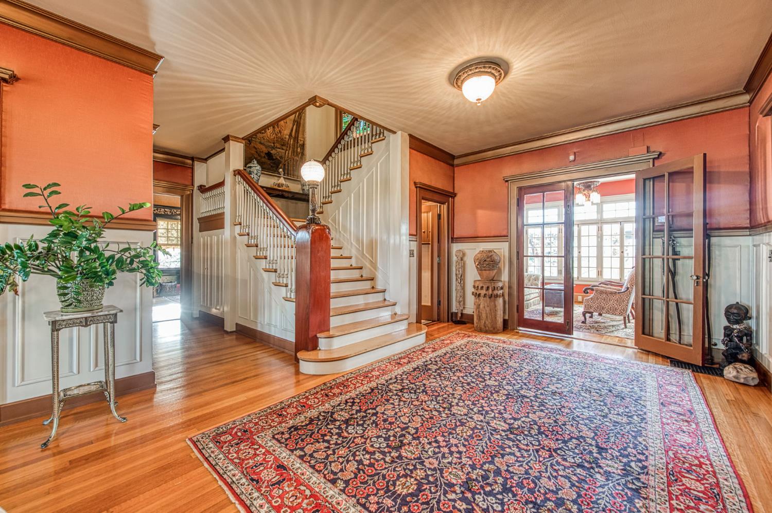 9486 East Lincoln Avenue Del Rey, CA 93616 - Photo 1 of 77 a view of a livingroom with wooden floor and stairs