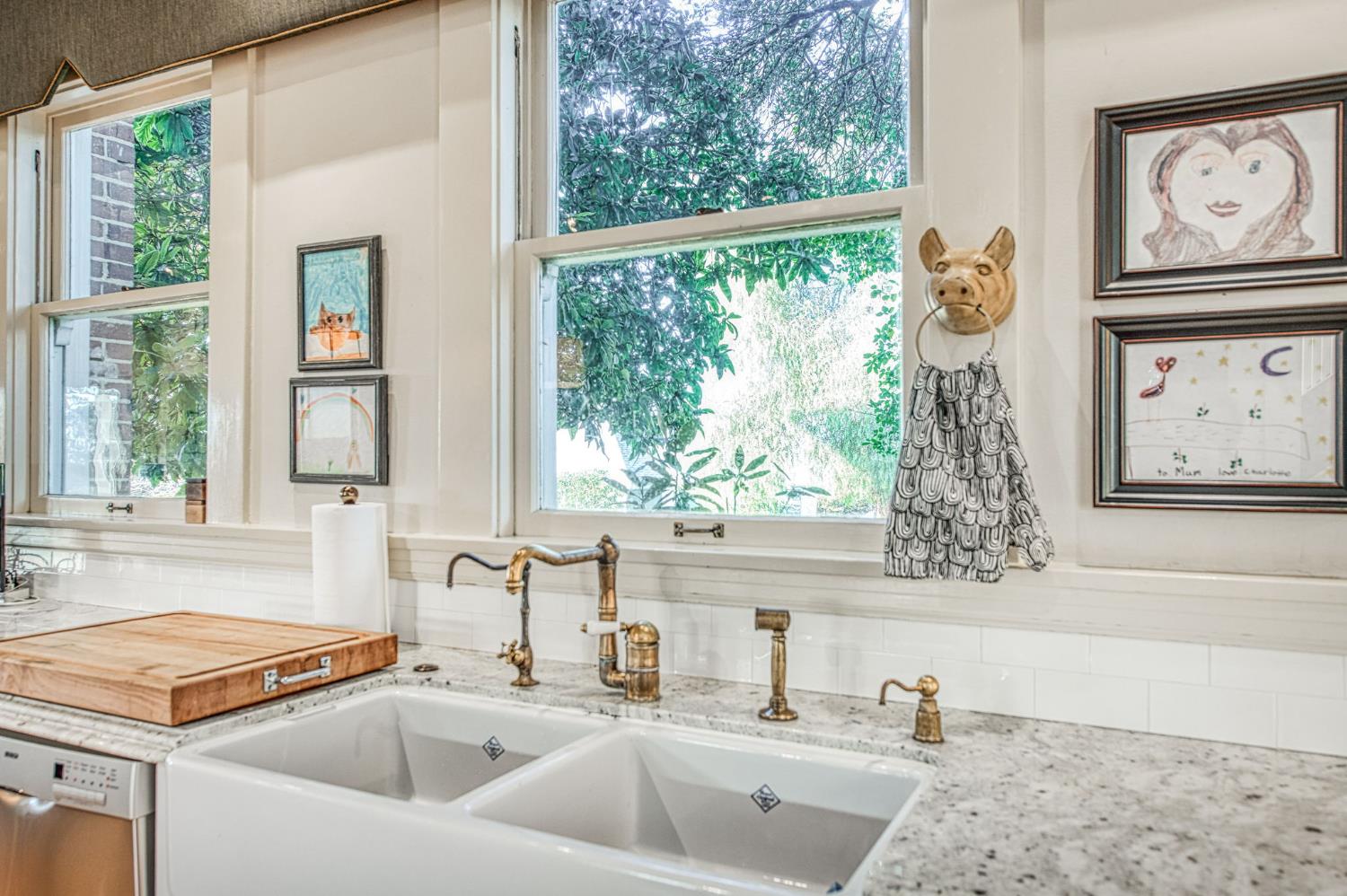 9486 East Lincoln Avenue Del Rey, CA 93616 - Photo 24 of 77 a bathroom with a granite countertop sink and a large window