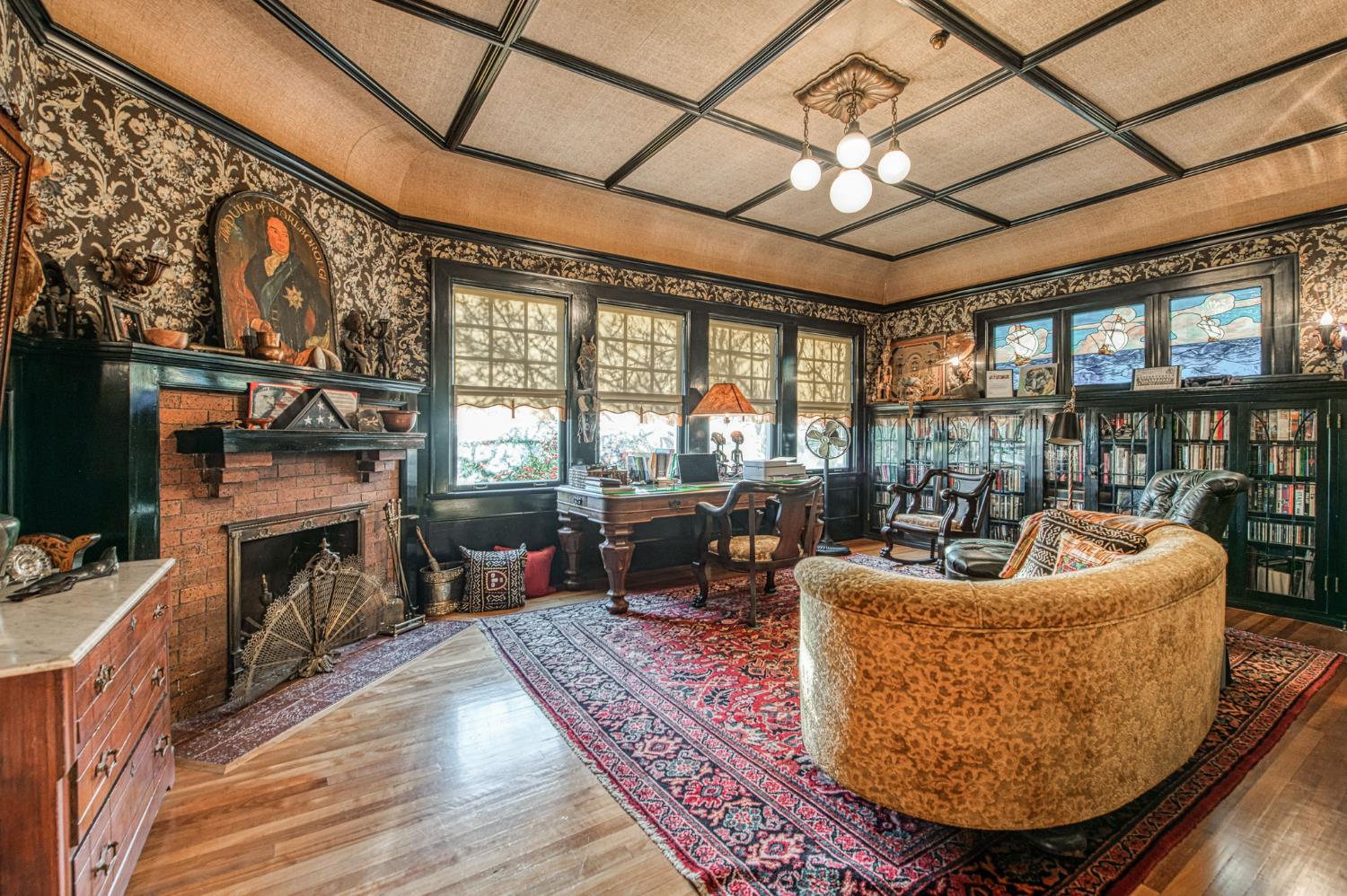 9486 East Lincoln Avenue Del Rey, CA 93616 - Photo 29 of 77 a living room with furniture a fireplace and a floor to ceiling window