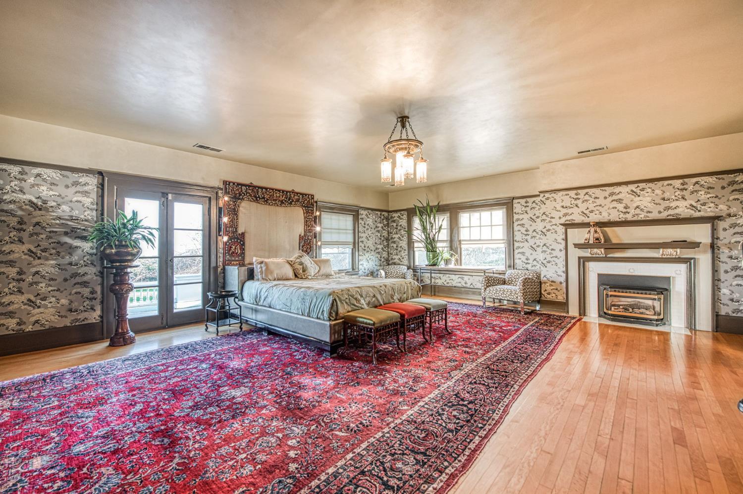 9486 East Lincoln Avenue Del Rey, CA 93616 - Photo 43 of 77 a spacious bedroom with a bed and wooden floor