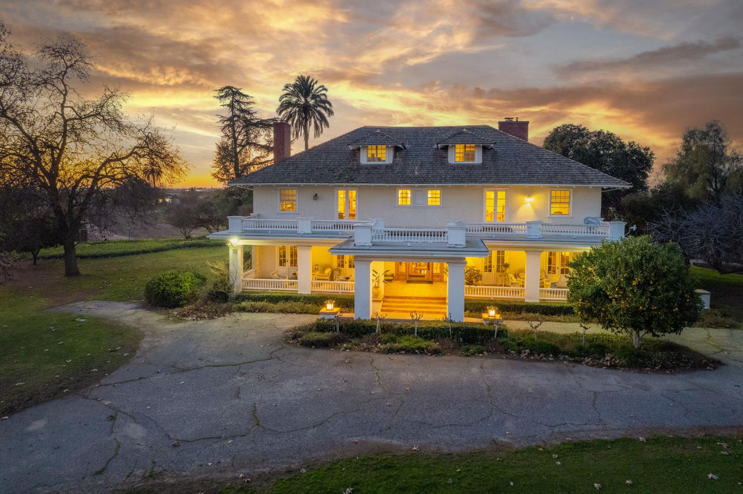 9486 East Lincoln Avenue Del Rey, CA 93616 - Photo 52 of 77 a front view of a house with a yard and garage