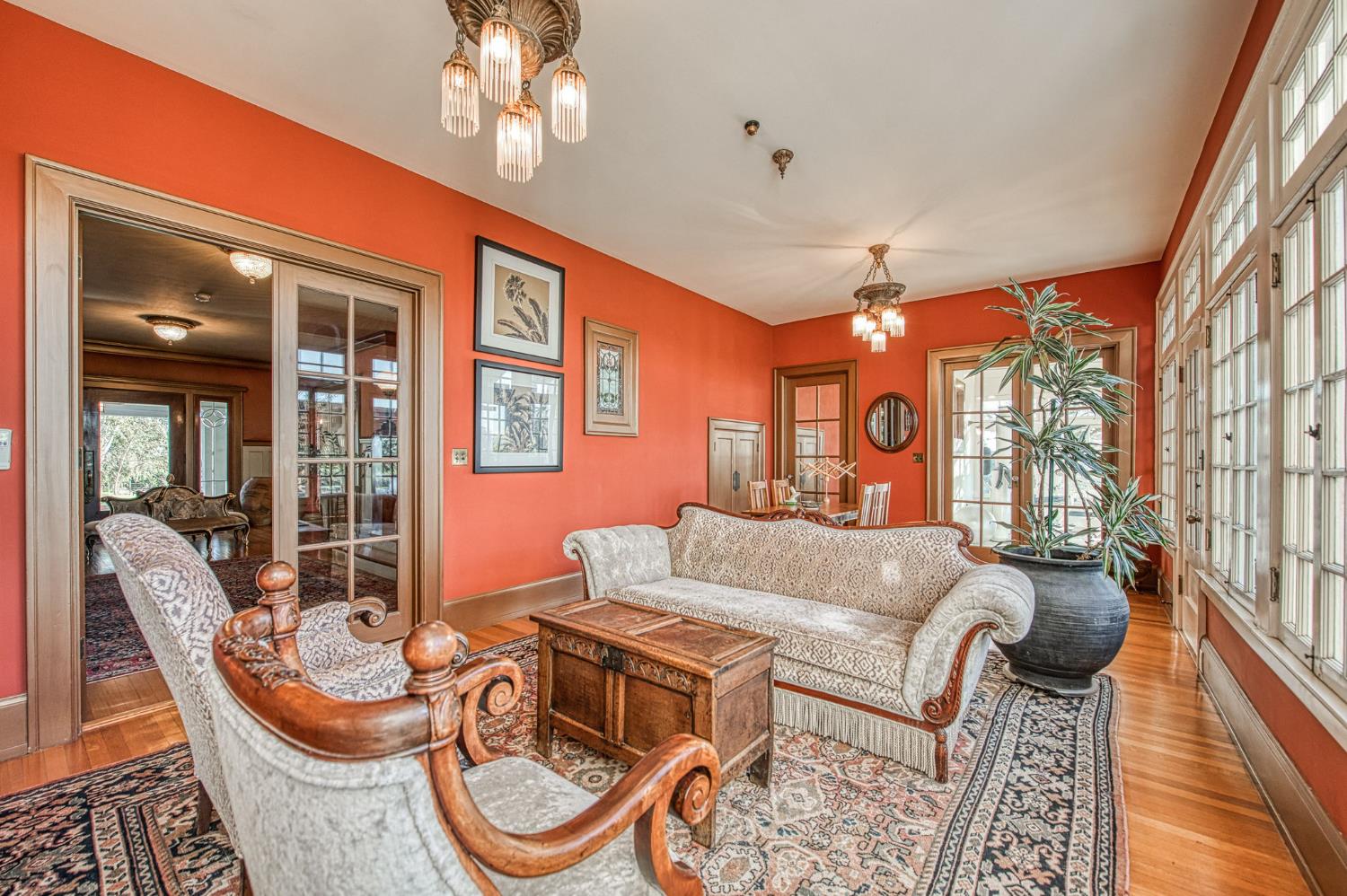 9486 East Lincoln Avenue Del Rey, CA 93616 - Photo 9 of 77 a living room with furniture a chandelier and a large window