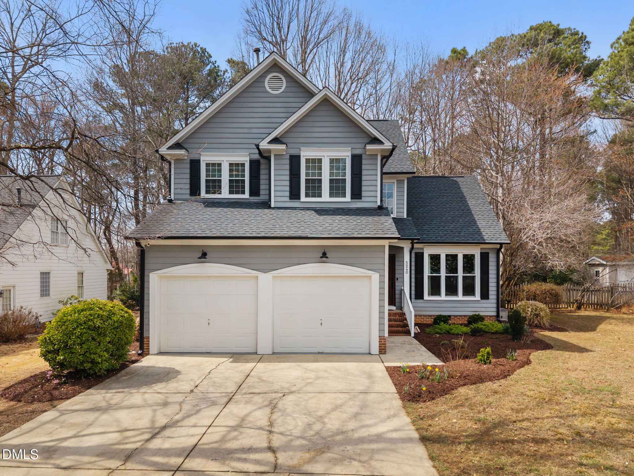 5240 Fairmead Circle Raleigh, NC 27613 - Photo 1 of 52 a front view of a house with a yard and garage