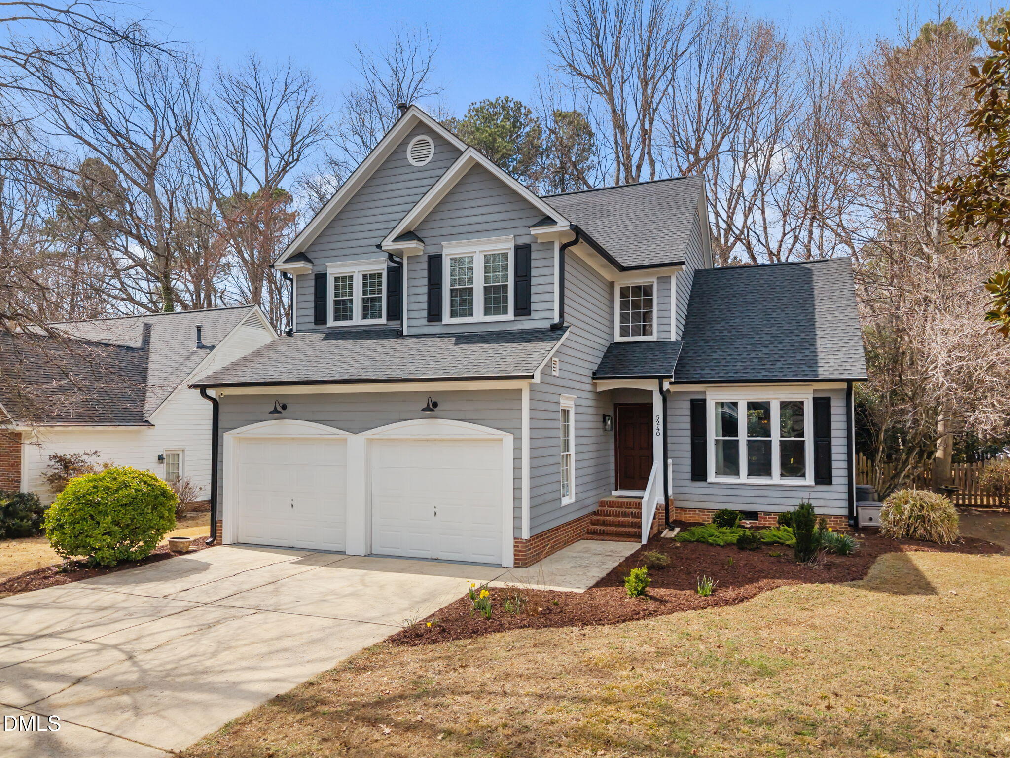 5240 Fairmead Circle Raleigh, NC 27613 - Photo 2 of 52 a front view of a house with a yard and garage