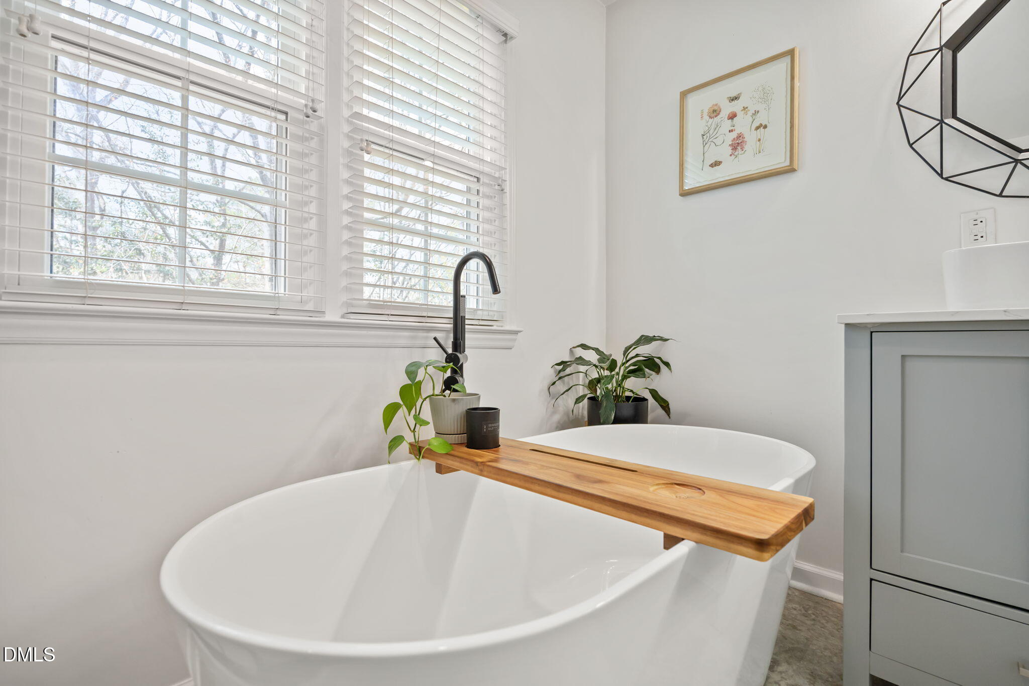 5240 Fairmead Circle Raleigh, NC 27613 - Photo 29 of 52 a bath tub sitting in a bathroom next to a window