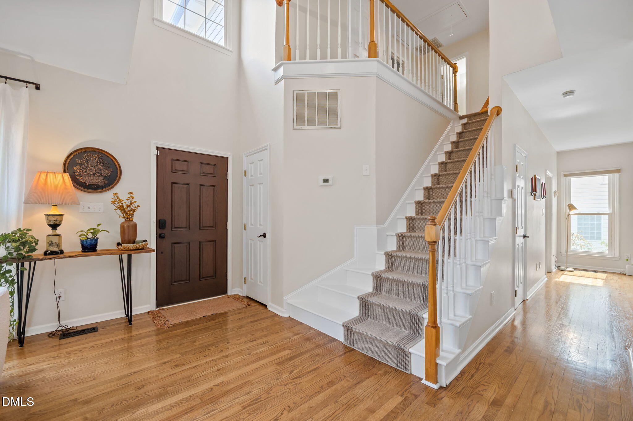 5240 Fairmead Circle Raleigh, NC 27613 - Photo 33 of 52 a view of a livingroom with wooden floor and stairs