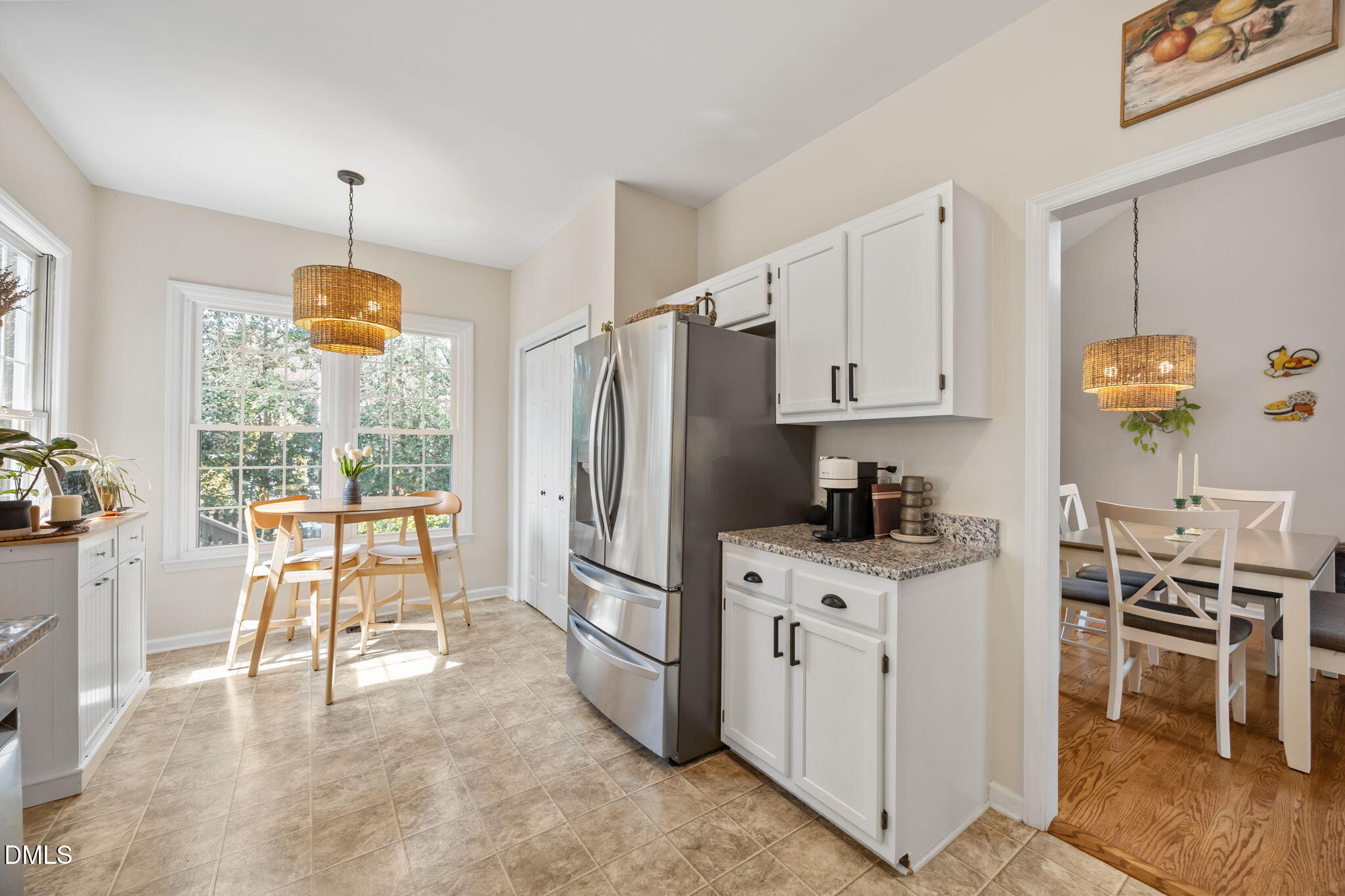 5240 Fairmead Circle Raleigh, NC 27613 - Photo 39 of 52 a kitchen with a stove a refrigerator and chairs