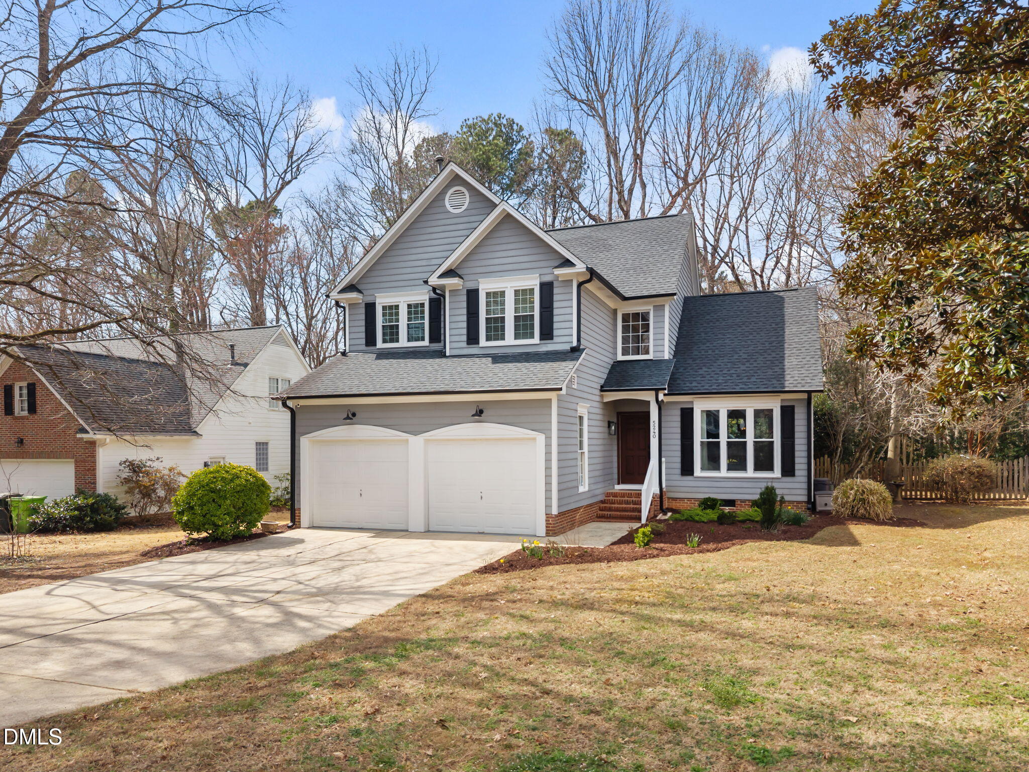 5240 Fairmead Circle Raleigh, NC 27613 - Photo 4 of 52 a front view of a house with a yard and garage