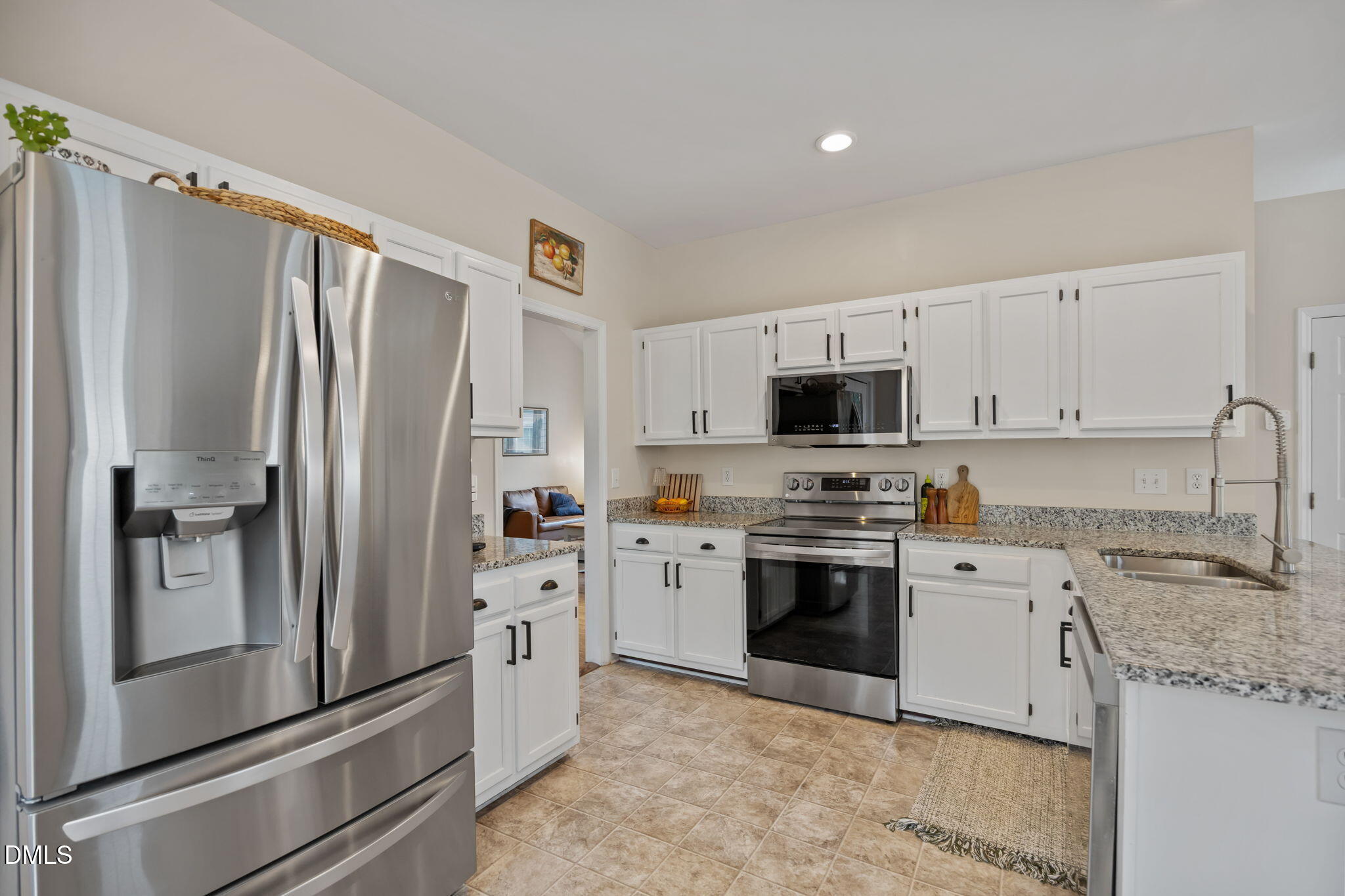 5240 Fairmead Circle Raleigh, NC 27613 - Photo 41 of 52 a kitchen with stainless steel appliances granite countertop a refrigerator sink and stove
