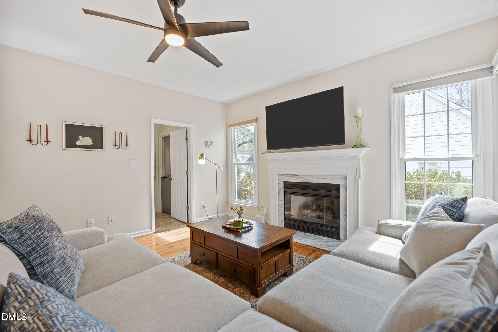5240 Fairmead Circle Raleigh, NC 27613 - Photo 43 of 52 a living room with furniture a flat screen tv and a fireplace