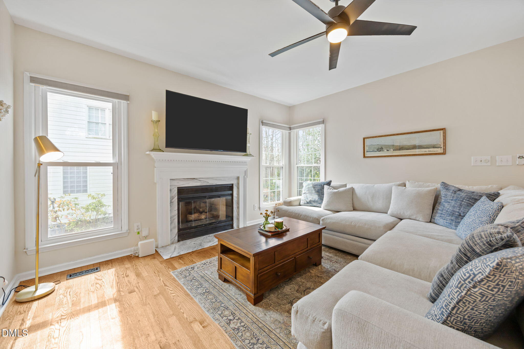 5240 Fairmead Circle Raleigh, NC 27613 - Photo 44 of 52 a living room with furniture a flat screen tv and a fireplace