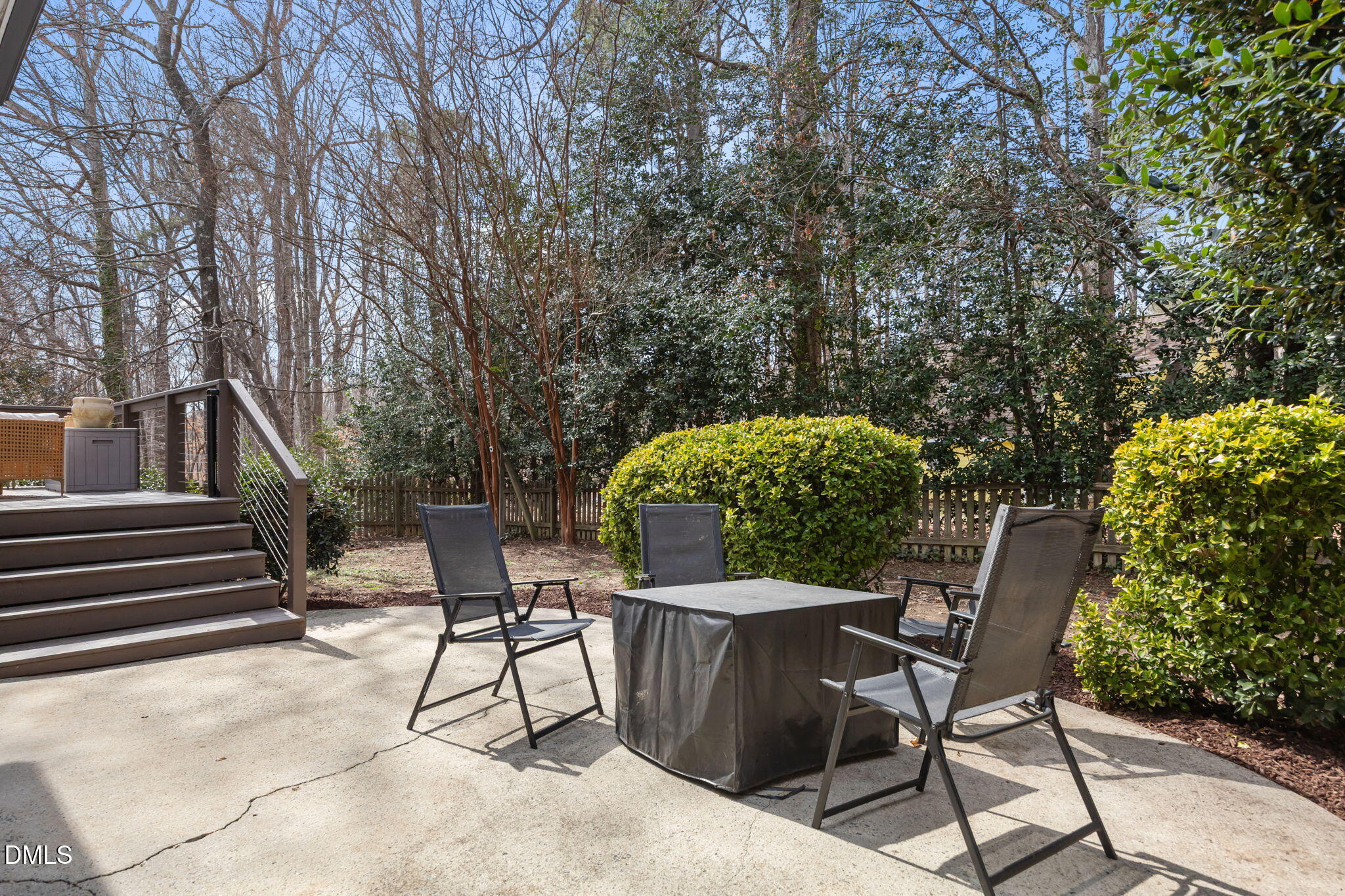5240 Fairmead Circle Raleigh, NC 27613 - Photo 52 of 52 a view of a chairs and table in the back yard of the house