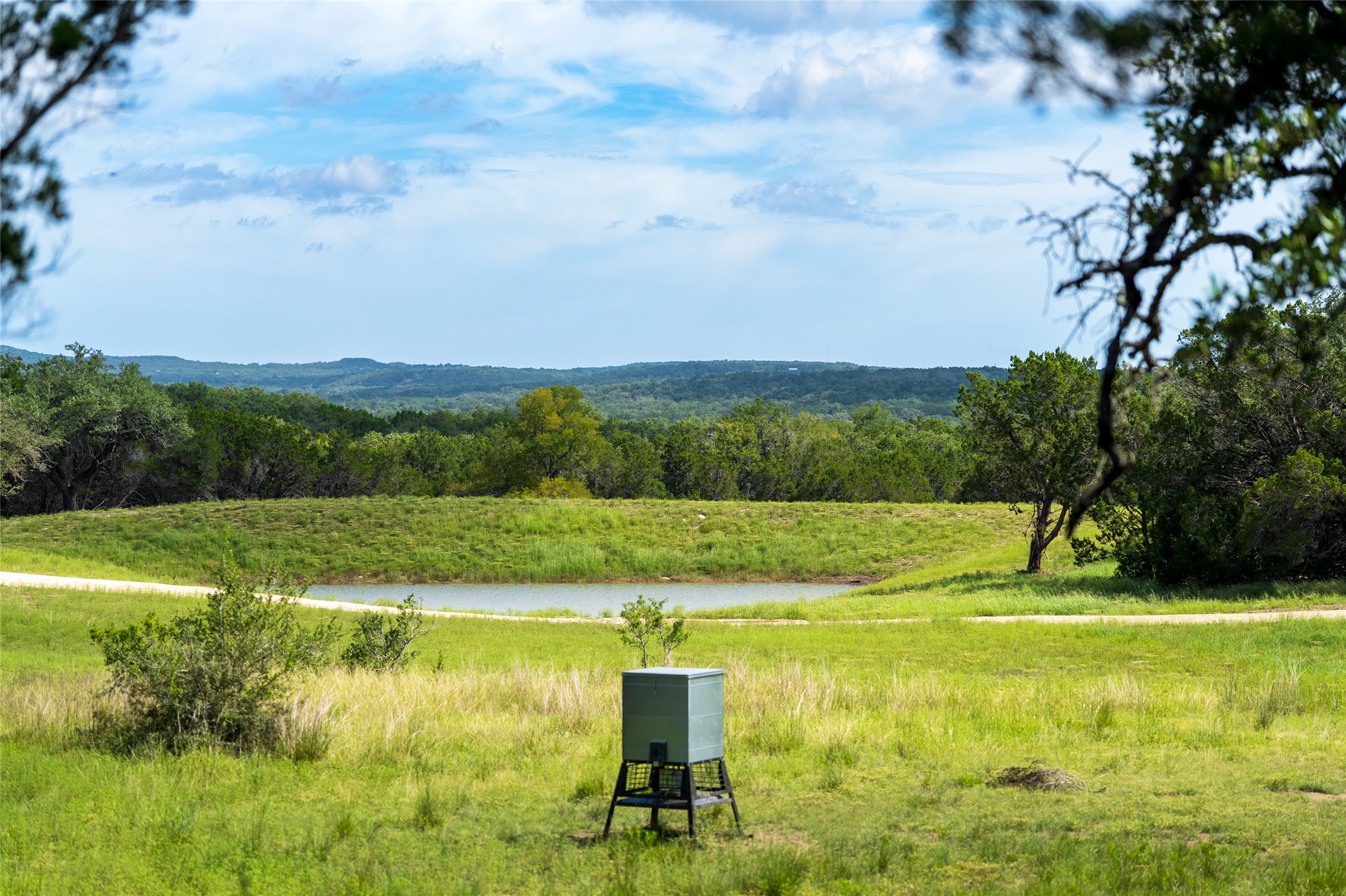 5 Pump Station Road Wimberley, TX 78676 - Photo 18 of 24 View of property's community featuring a water view and a forest view