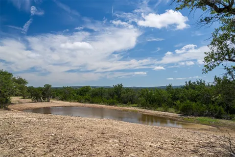 a view of pool with a yard