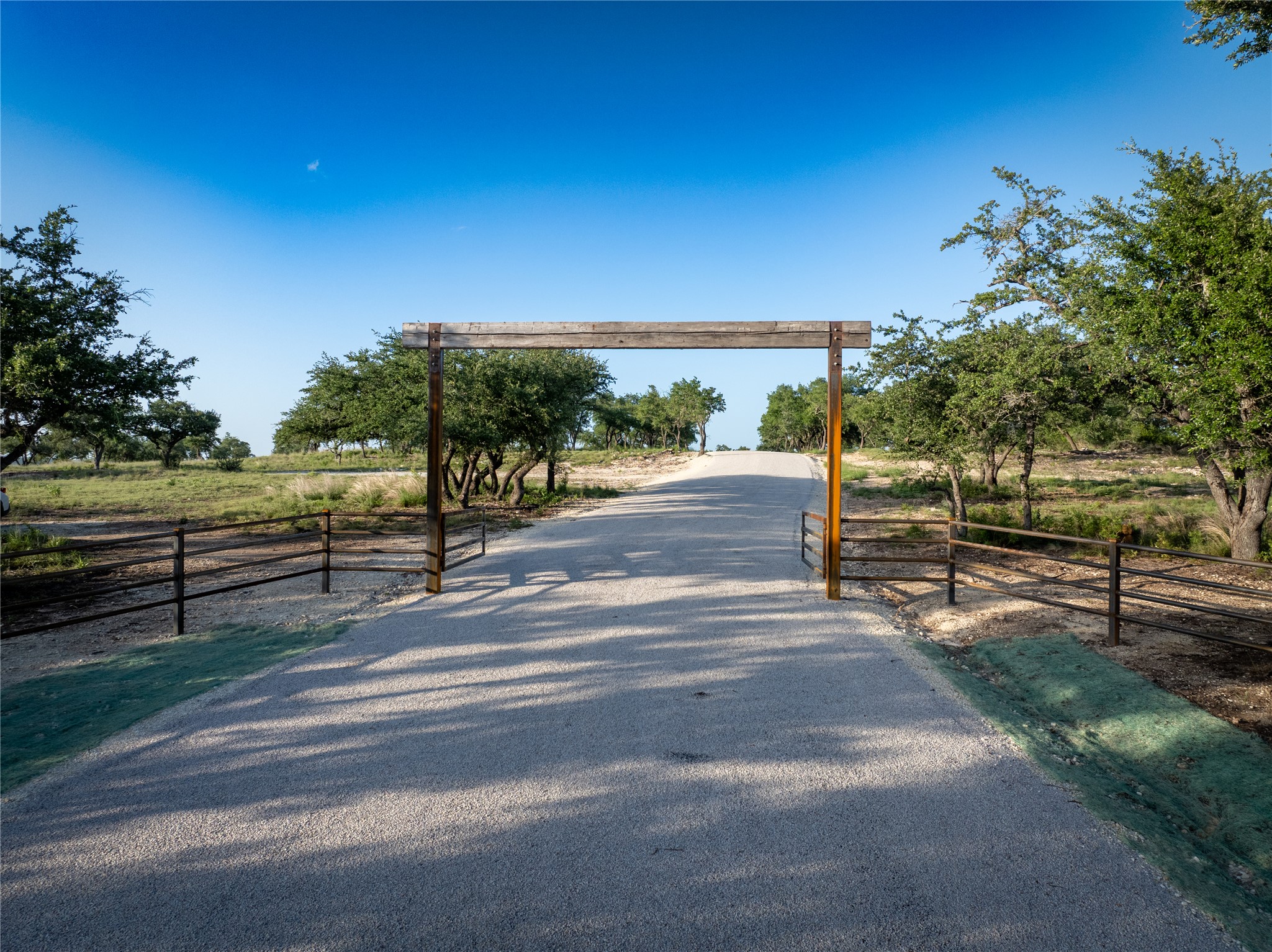 5 Pump Station Road Wimberley, TX 78676 - Photo 24 of 24 View of asphalt driveway with a view of rural / pastoral area and a gated entry