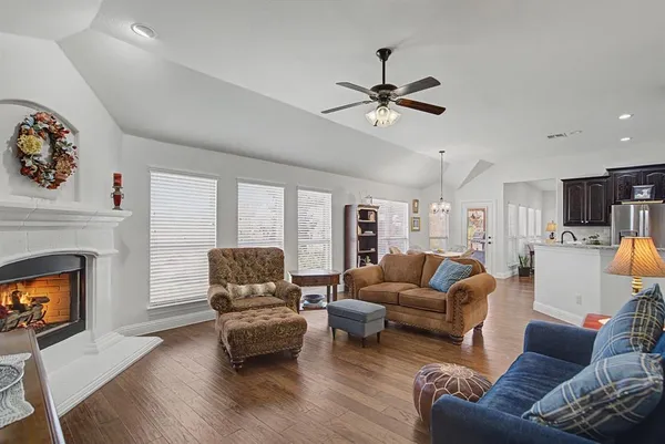 a living room with furniture and a fireplace