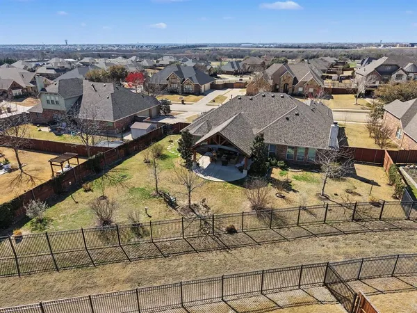 an aerial view of residential houses with outdoor space