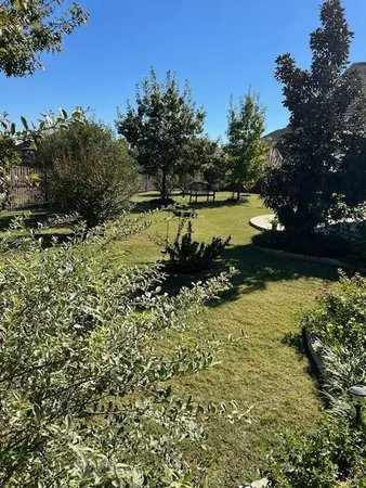 a view of a lake with a yard