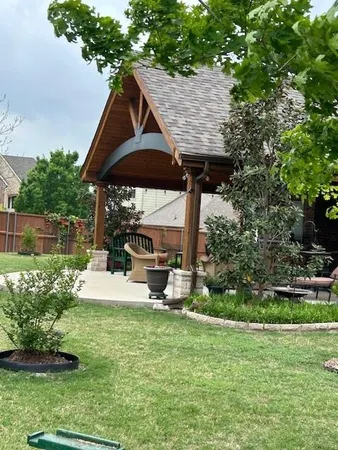 a view of a chair and table of the garden