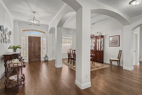 a view of a livingroom with furniture and hardwood floor