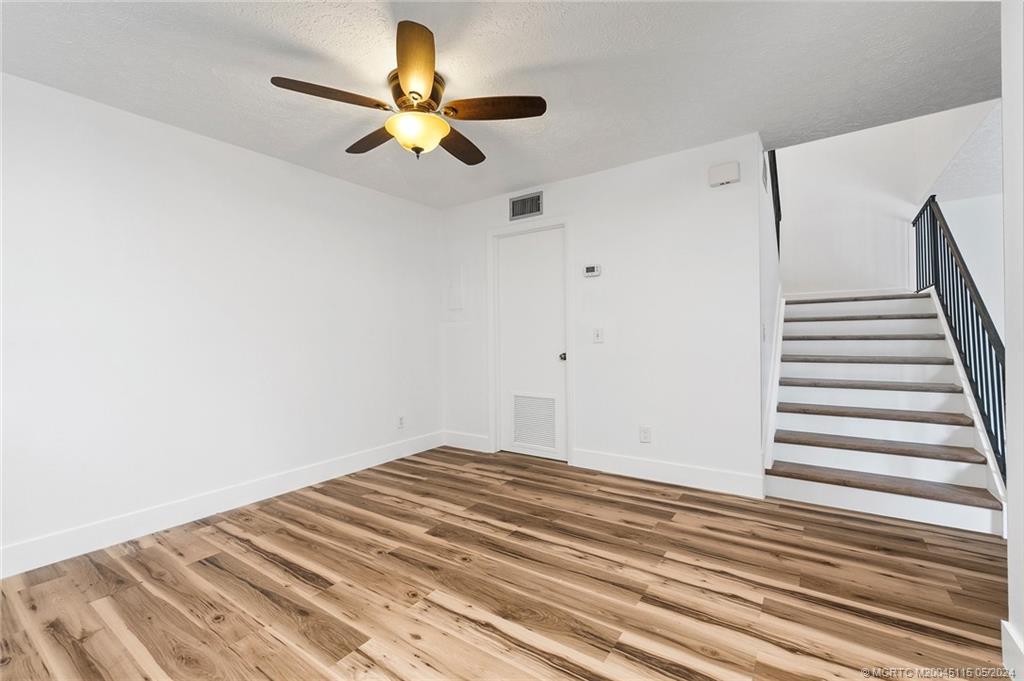 762 Northwest 10th Terrace Stuart, FL 34994 - Photo 14 of 41 a view of a room with wooden floor