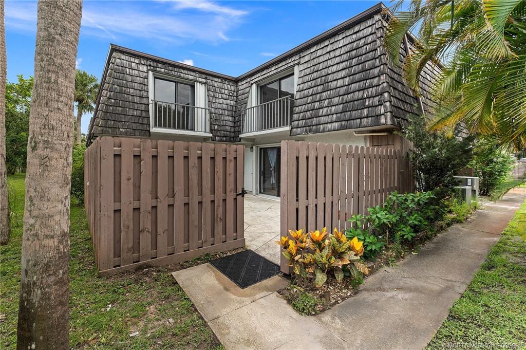 762 Northwest 10th Terrace Stuart, FL 34994 - Photo 2 of 41 a garden view with a seating space