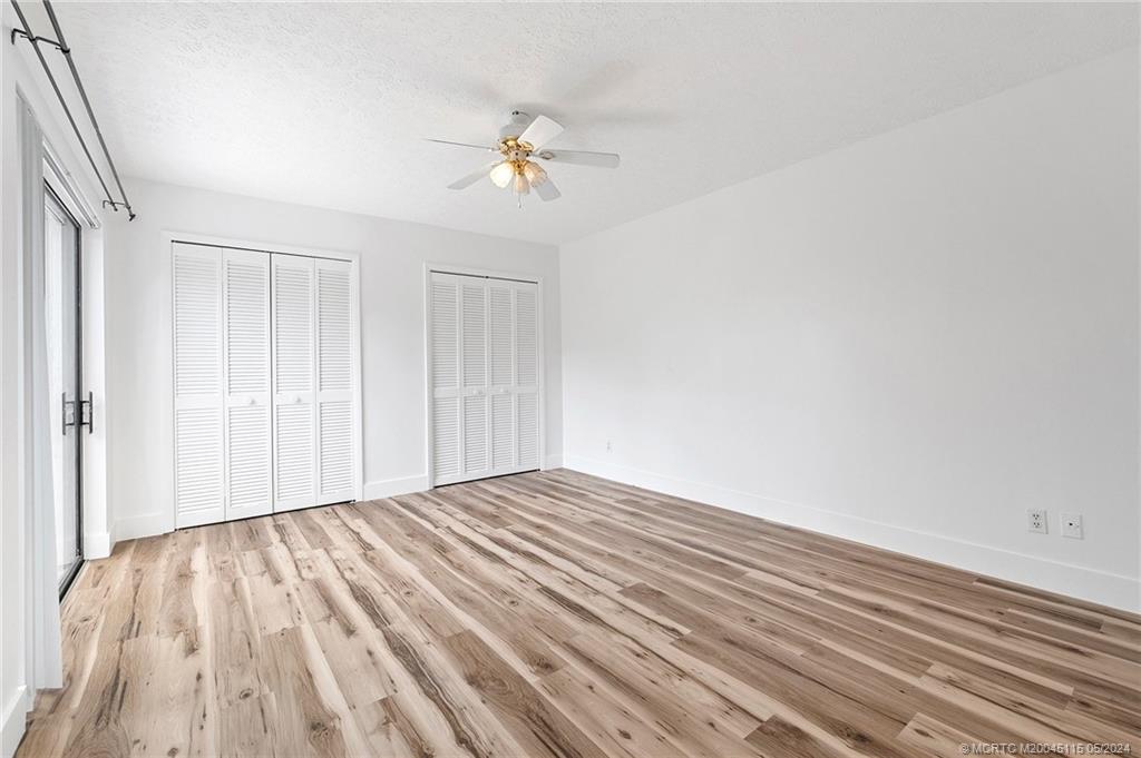 762 Northwest 10th Terrace Stuart, FL 34994 - Photo 30 of 41 a view of an empty room with wooden floor