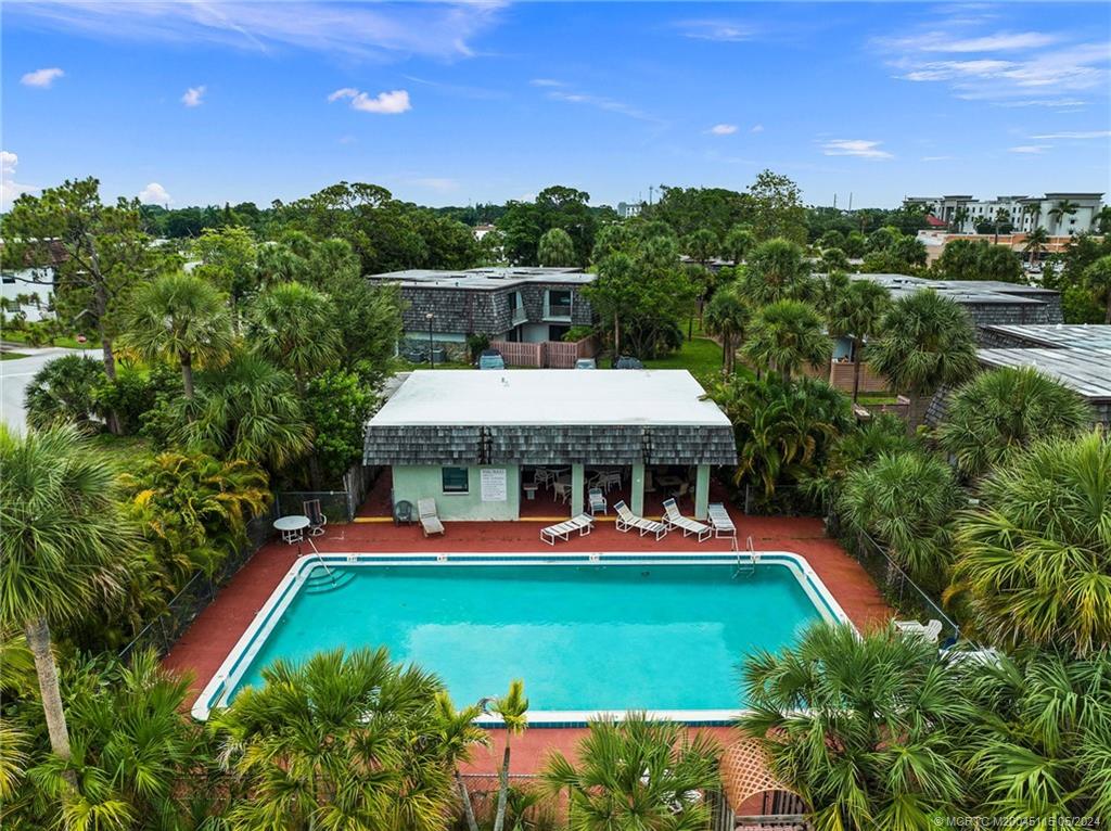 762 Northwest 10th Terrace Stuart, FL 34994 - Photo 38 of 41 an aerial view of a house with swimming pool patio and outdoor seating