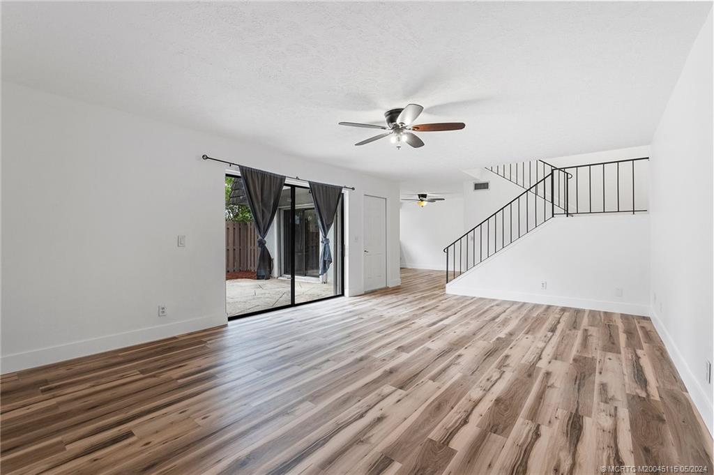 762 Northwest 10th Terrace Stuart, FL 34994 - Photo 7 of 41 a view of empty room with wooden floor