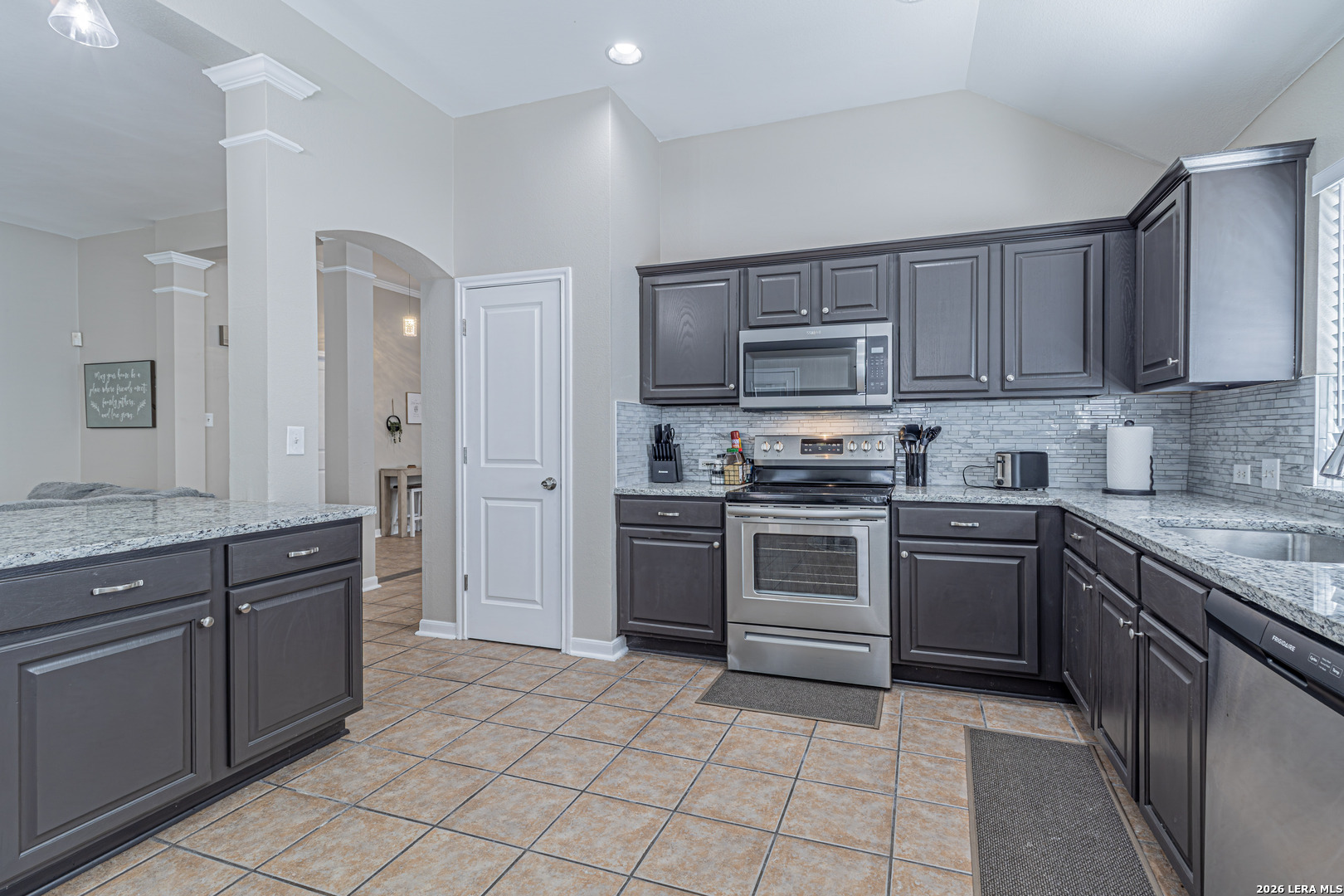 1815 Indian Paint Brush Road San Antonio, TX 78232 - Photo 13 of 35 a kitchen with cabinets stainless steel appliances and a counter space