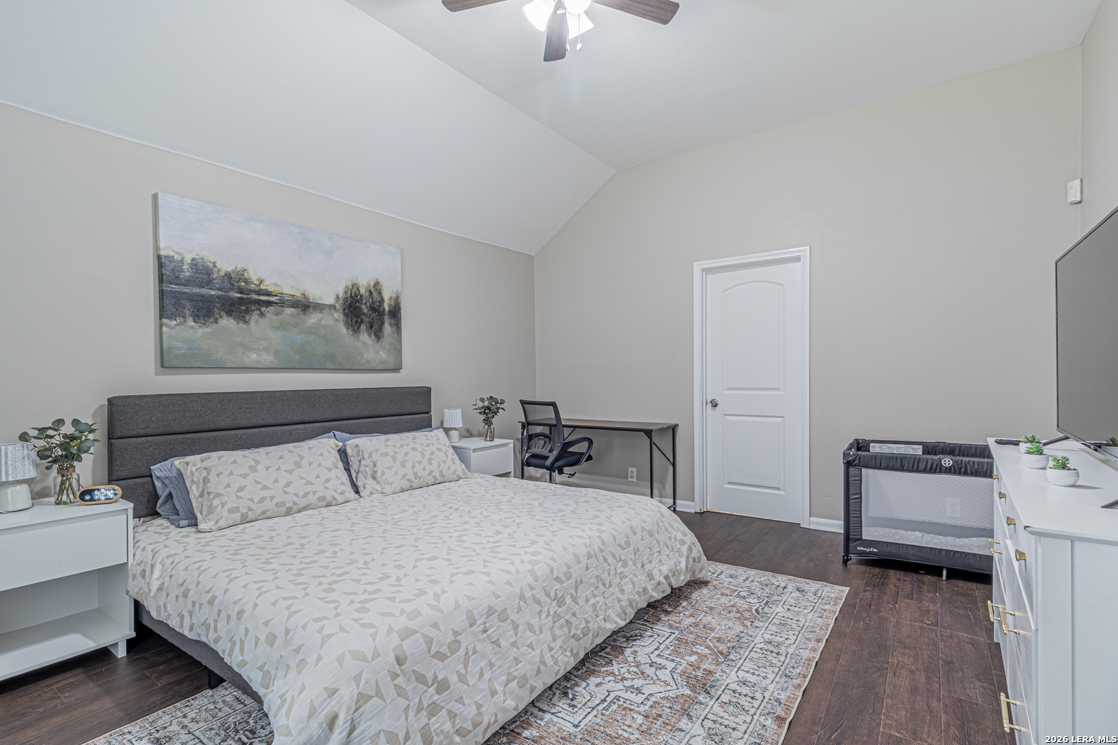 1815 Indian Paint Brush Road San Antonio, TX 78232 - Photo 20 of 35 a bedroom with bed and a chandelier