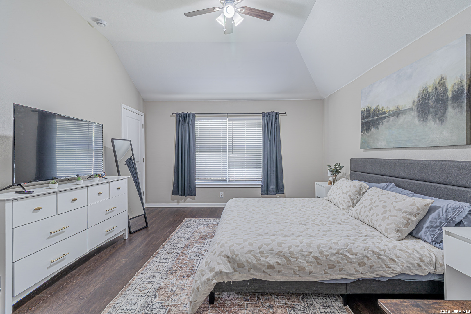 1815 Indian Paint Brush Road San Antonio, TX 78232 - Photo 21 of 35 a bedroom with a large bed and a flat tv screen on dresser