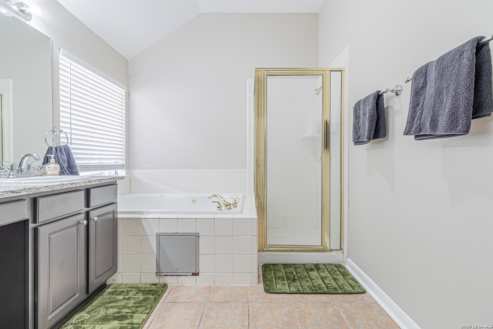 1815 Indian Paint Brush Road San Antonio, TX 78232 - Photo 24 of 35 a bathroom with a sink a mirror and a toilet