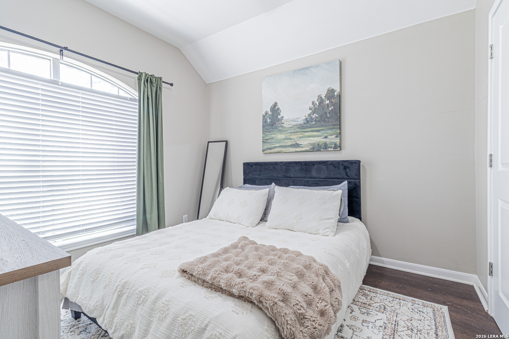 1815 Indian Paint Brush Road San Antonio, TX 78232 - Photo 27 of 35 a bedroom with a large bed and a window