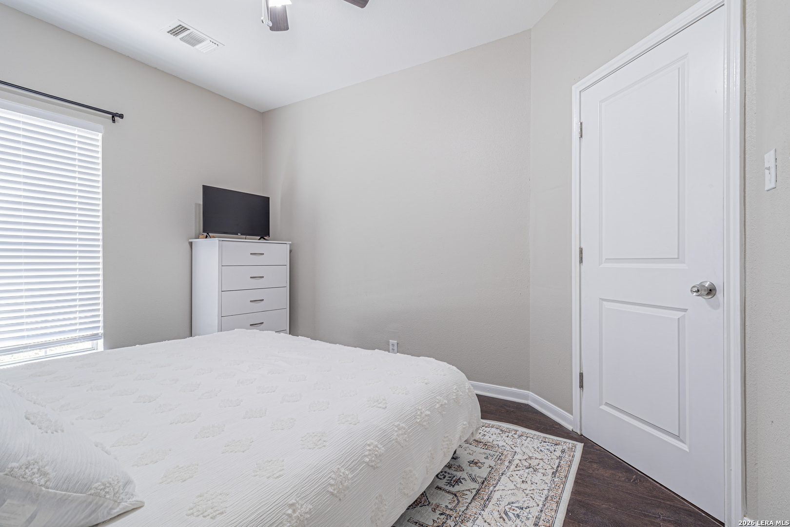 1815 Indian Paint Brush Road San Antonio, TX 78232 - Photo 29 of 35 a bedroom with a bed and a flat tv screen on dresser