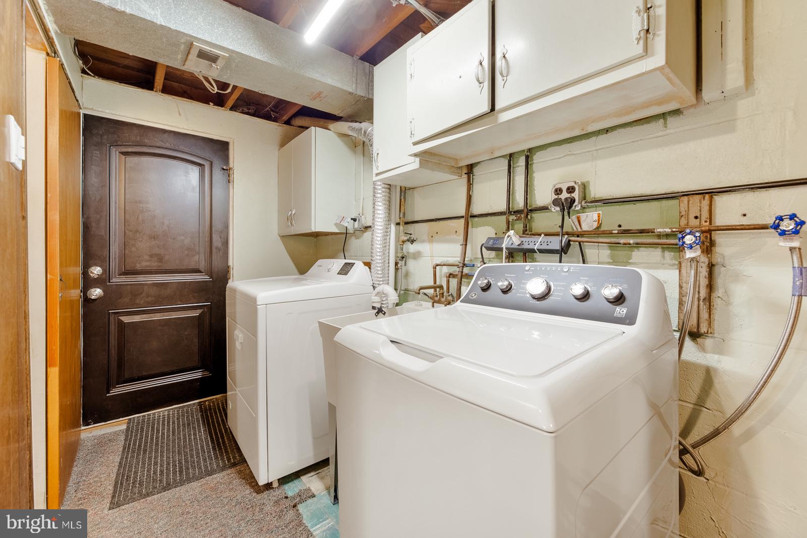 823 Rennard Street Philadelphia, PA 19116 - Photo 32 of 40 Functional laundry space with storage.