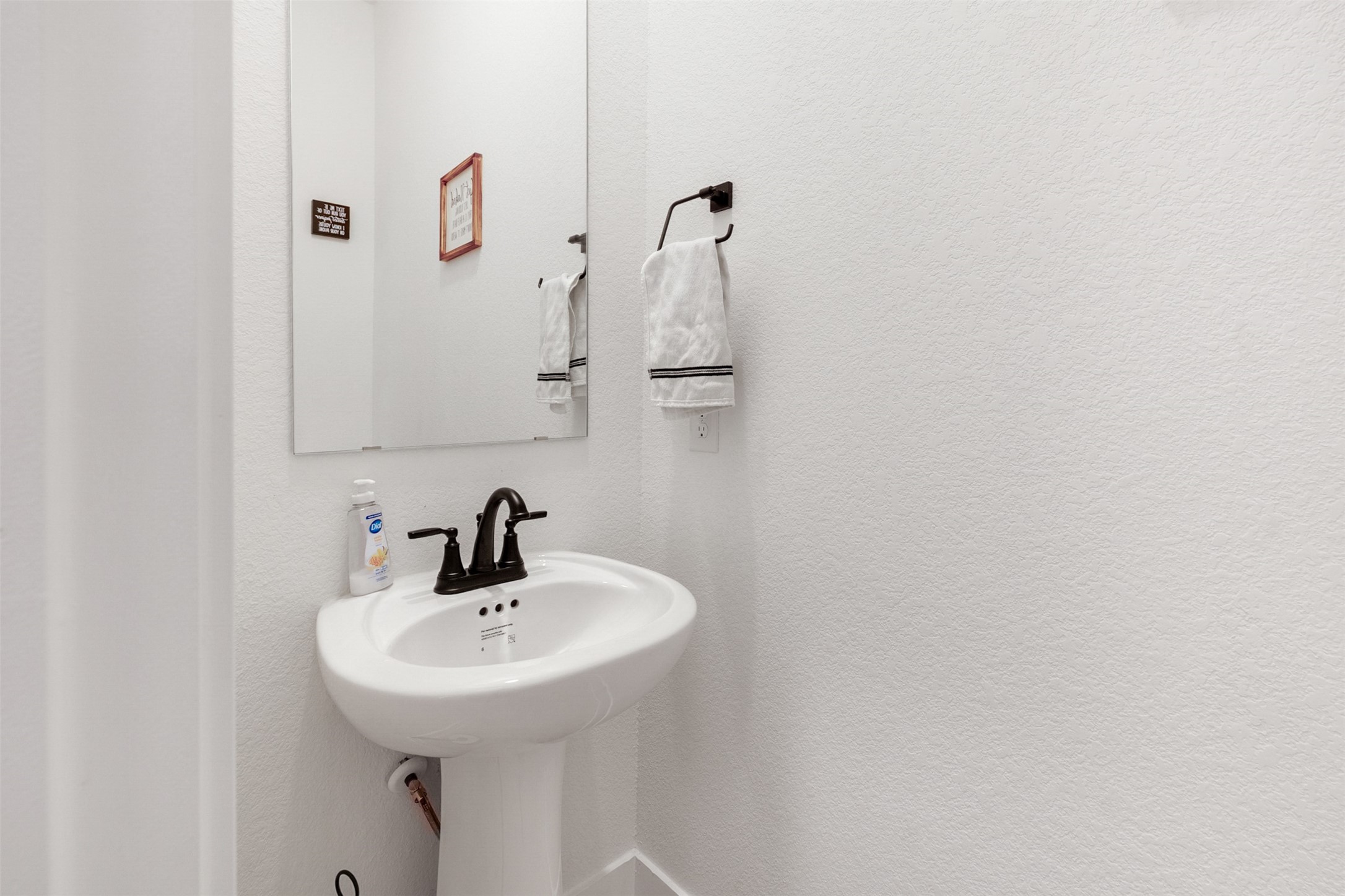 144 Red Cascade Trail Conroe, TX 77318 - Photo 25 of 34 The 1/2 bath is downstairs for easy access for you and guests.