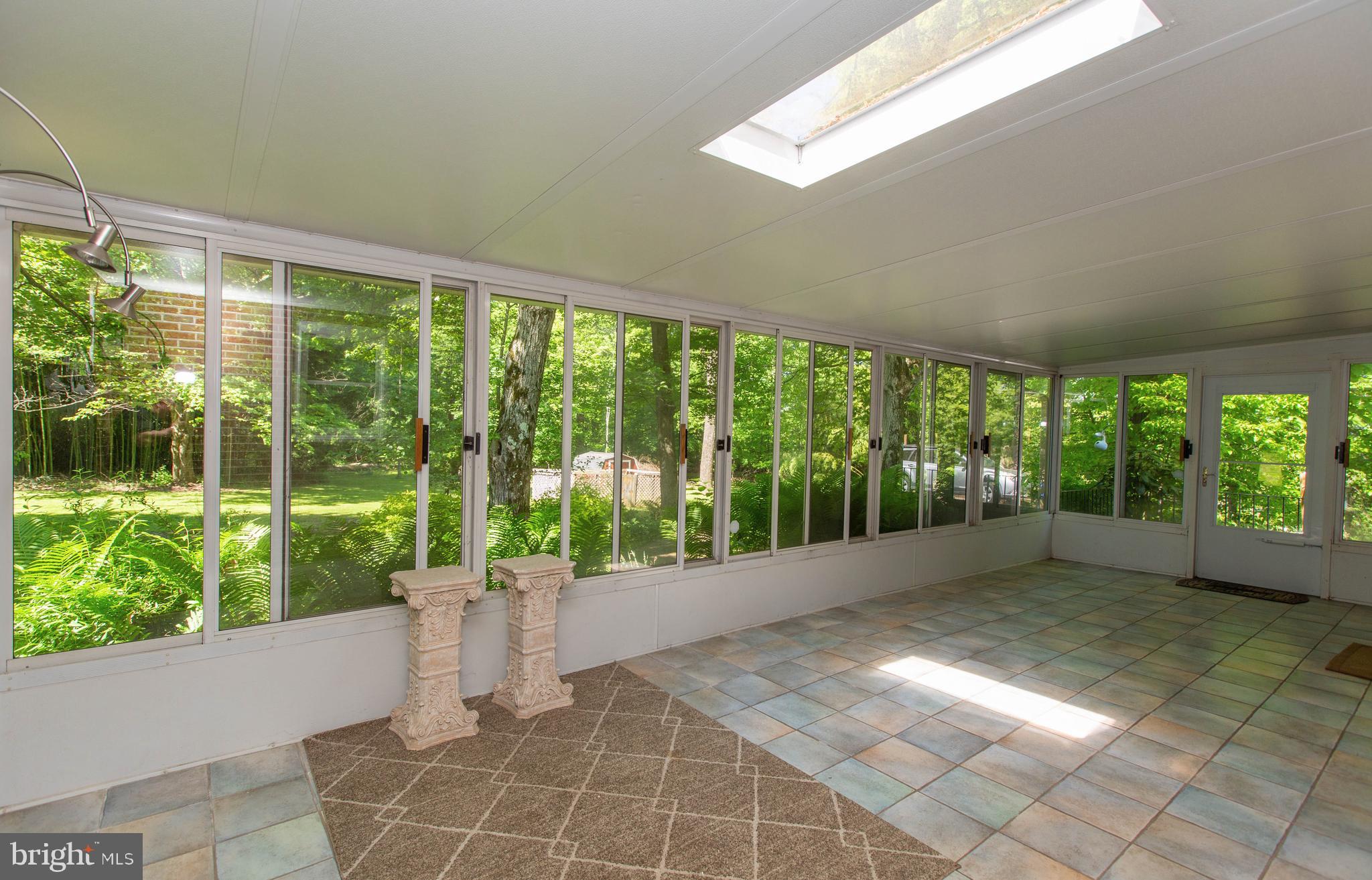 2980 Township Line Road Eagleville, PA 19403 - Photo 26 of 51 Spacious 3 Season room overlooks the back yard