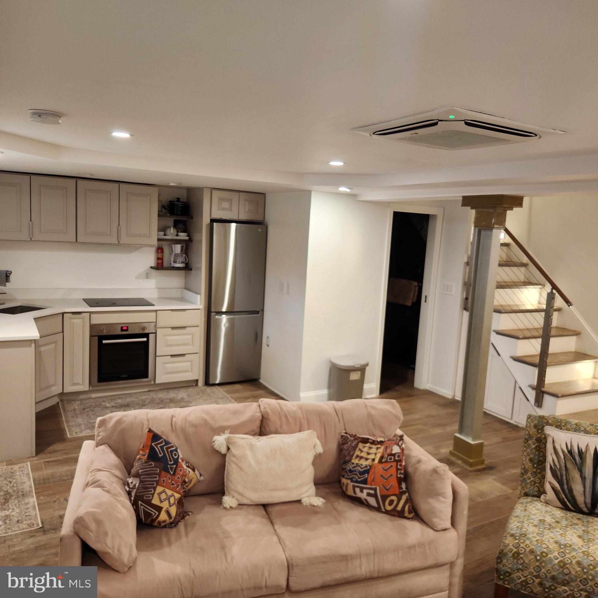 4303 13th Place Northeast Washington, DC 20017 - Photo 7 of 20 a living room with furniture and a fireplace