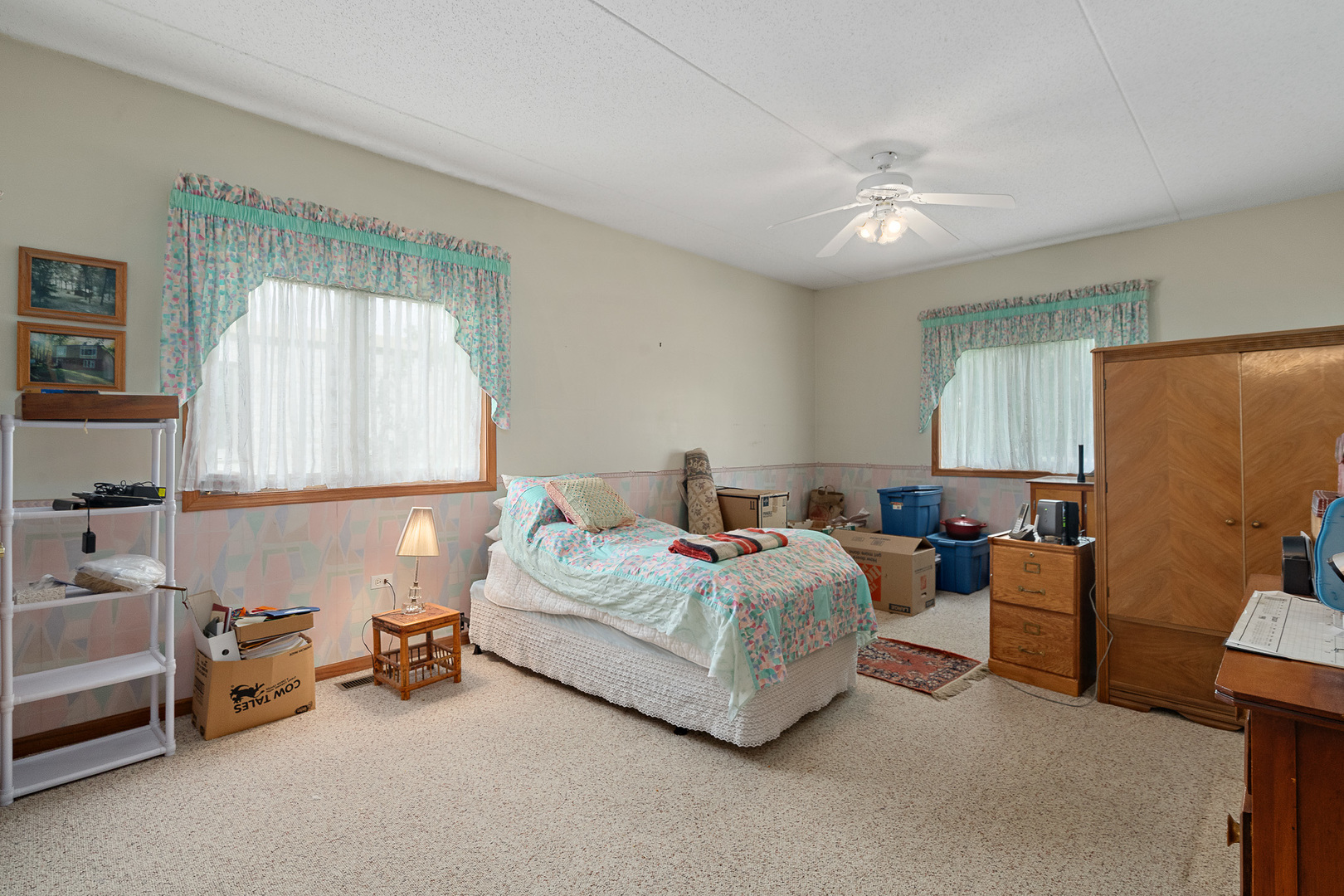 18431 Pine Cone Drive, Unit 1 Tinley Park, IL 60477 - Photo 12 of 33 a bedroom with bed and a chandelier