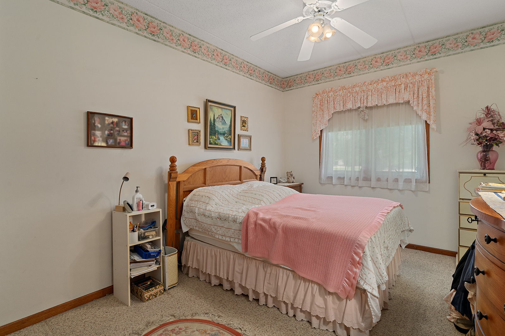 18431 Pine Cone Drive, Unit 1 Tinley Park, IL 60477 - Photo 17 of 33 a bedroom with a bed and a chandelier