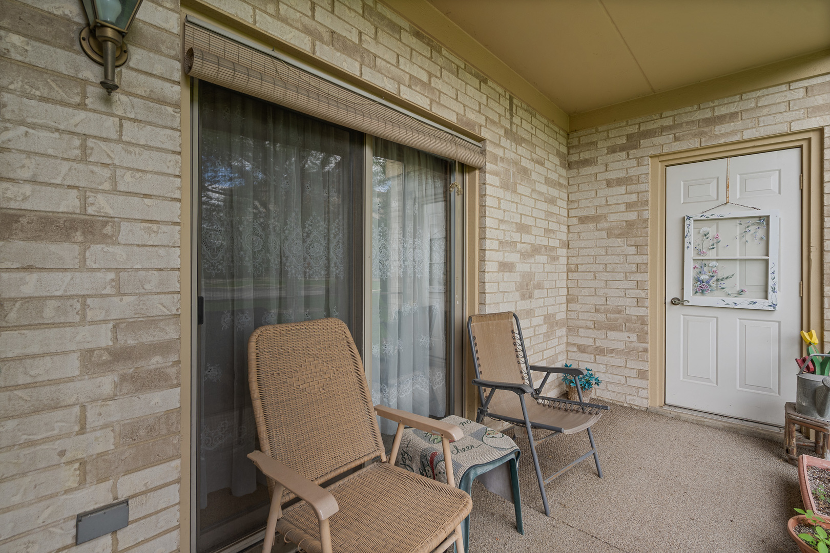 18431 Pine Cone Drive, Unit 1 Tinley Park, IL 60477 - Photo 20 of 33 a view of a chair and table in the back of the house