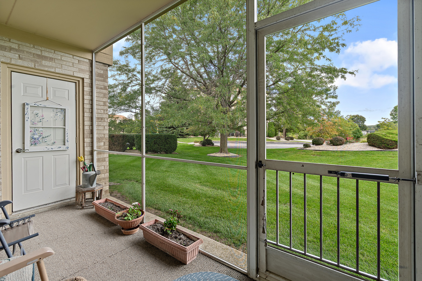 18431 Pine Cone Drive, Unit 1 Tinley Park, IL 60477 - Photo 21 of 33 a view of a room with porch and a yard