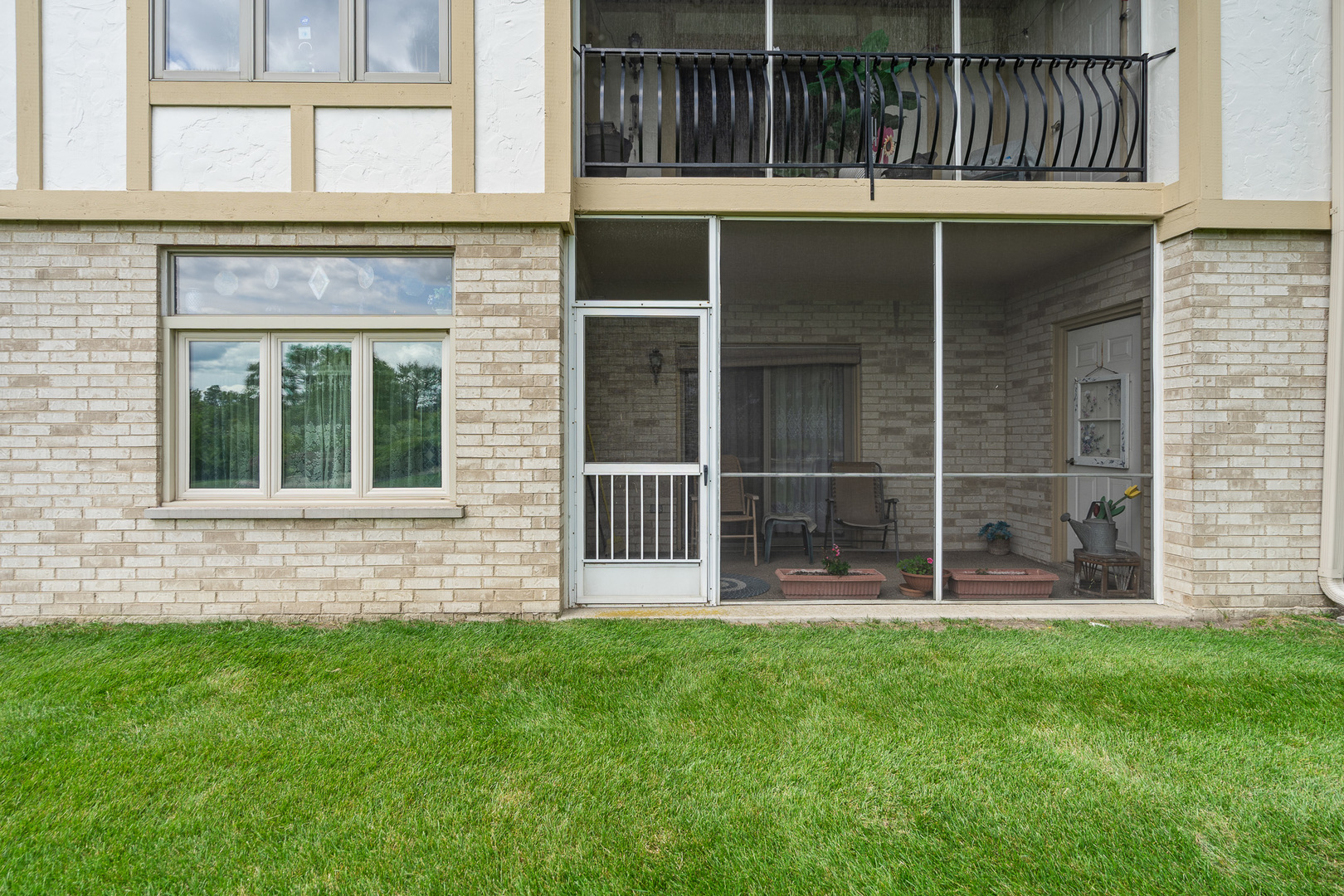 18431 Pine Cone Drive, Unit 1 Tinley Park, IL 60477 - Photo 22 of 33 a view of front door of house with yard