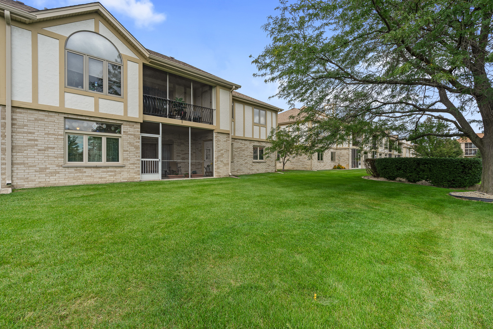 18431 Pine Cone Drive, Unit 1 Tinley Park, IL 60477 - Photo 24 of 33 a house view with a garden space